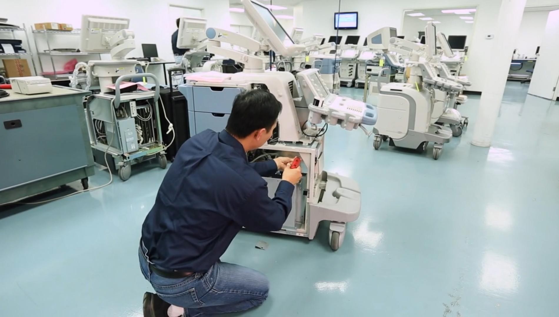 Technical engineer repairing medical equipment